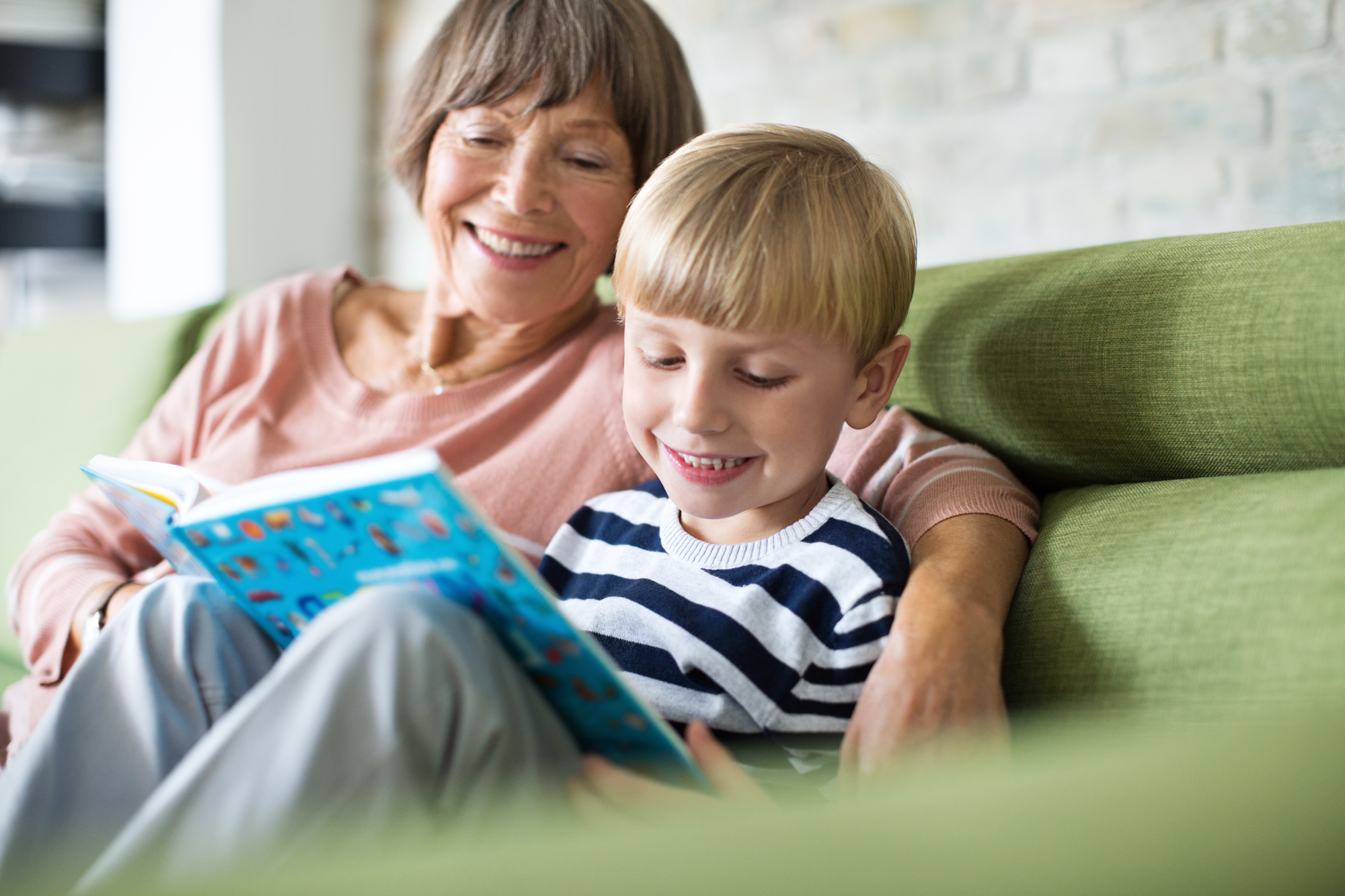 Grandma and grandson reading together